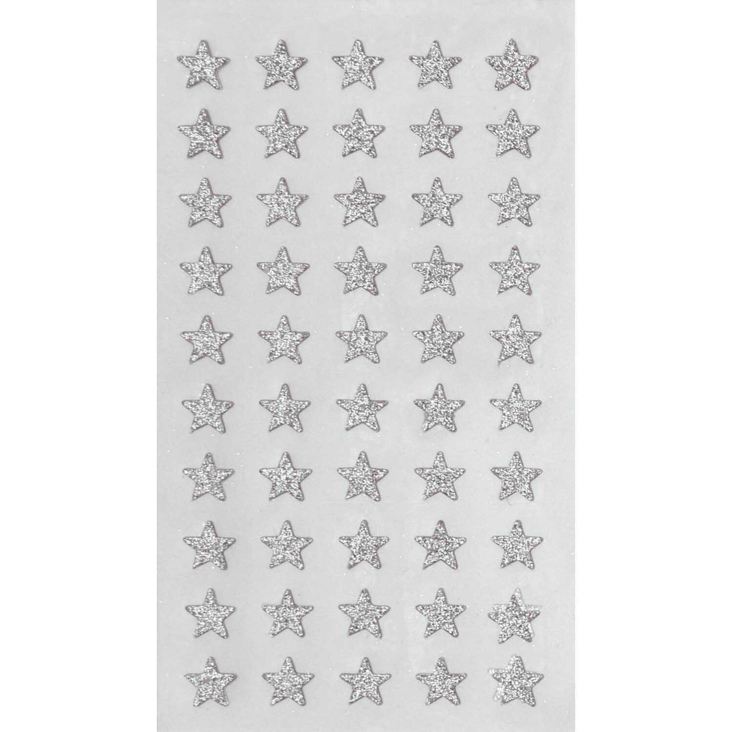 Paper Poetry Sticker mit silbernen Glitzersternen von Rico Design auf vier Blättern. Ideal für kreative Projekte.