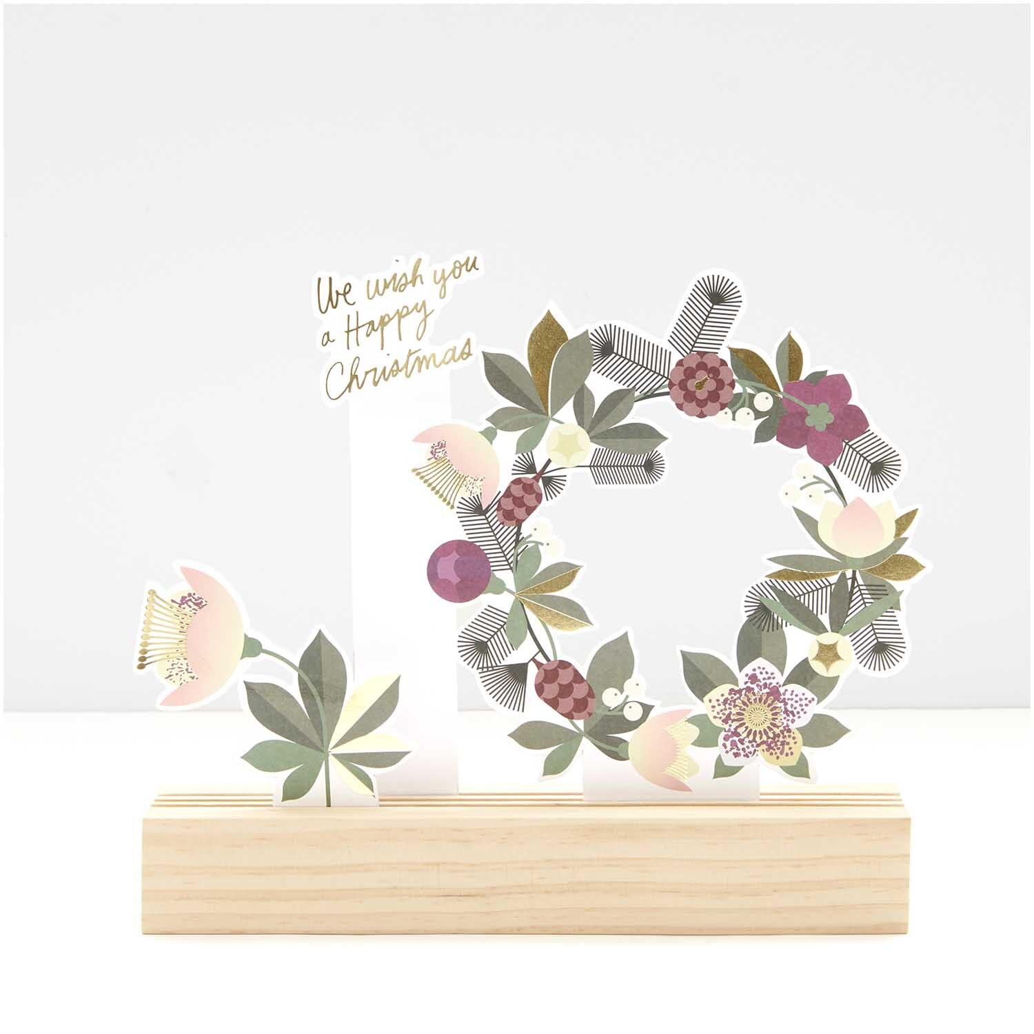 Paper Poetry Kartendeko-Set mit floralen Motiven und Holzständer, ideal für festliche Dekorationen.