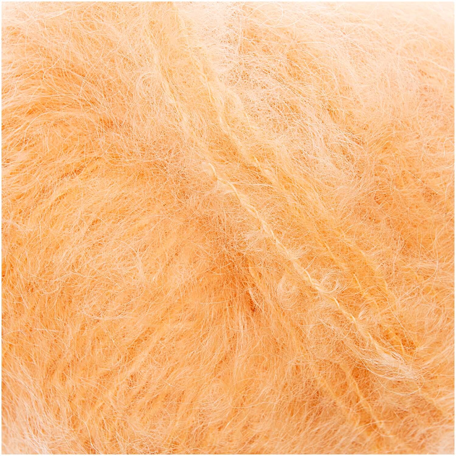 Fashion Mohair Merino Chunky: Weiches, apricotfarbenes Garn von Rico Design, ideal für Strickprojekte.