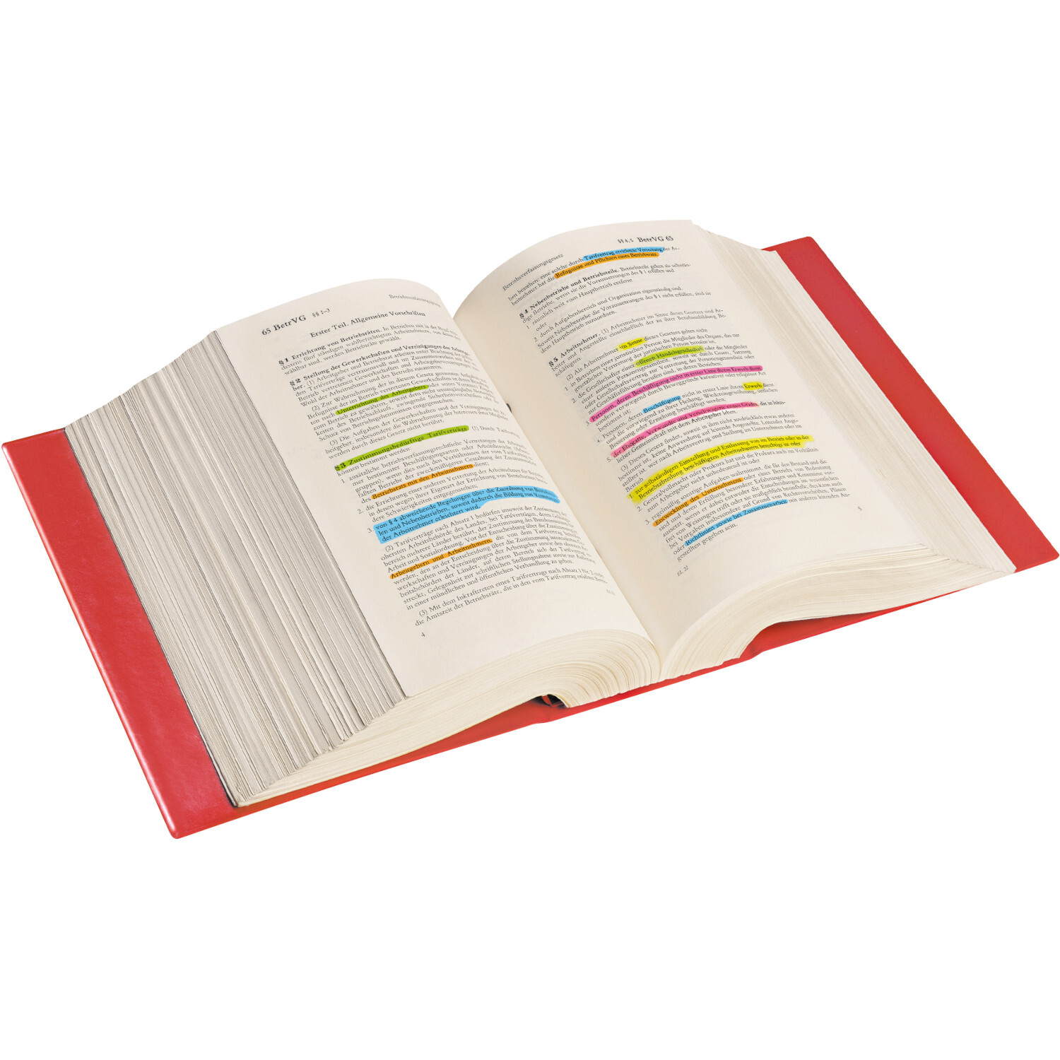 Jumbo Grip Textliner: Geöffnetes Buch mit farbigen Markierungen in Gelb, Blau und Pink, rote Buchdeckel.
