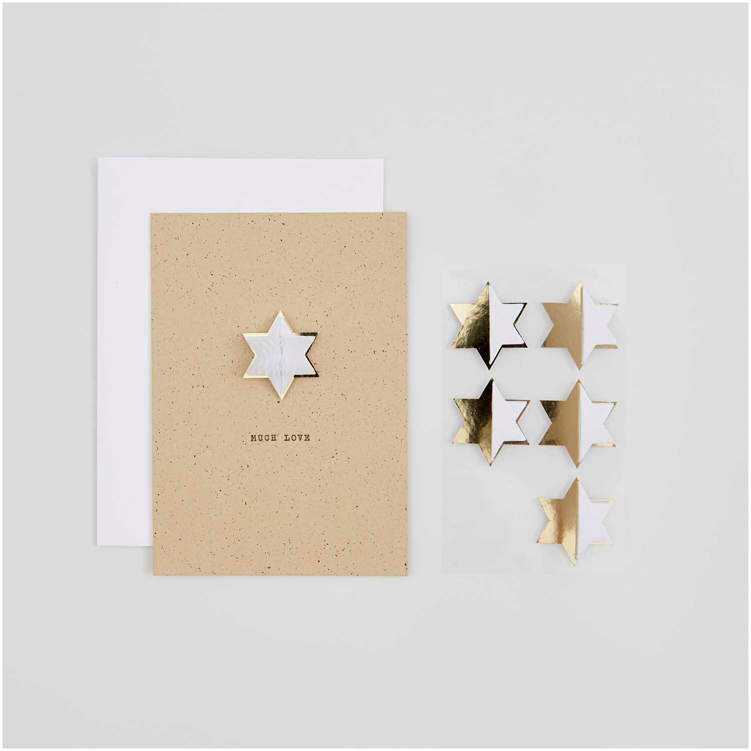 Paper Poetry Wabenpapiersticker Sterne auf einem Blatt. Goldene und silberne Sterne auf beigem Hintergrund. Ideal für kreative Dekorationen.