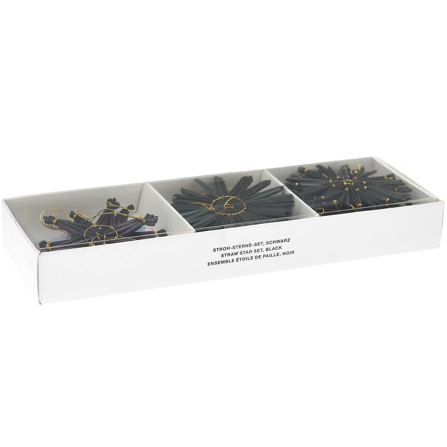 Strohstern-Set 6x6cm: Neunteiliges Set schwarzer Strohsterne von Rico Design in einer Verpackung.