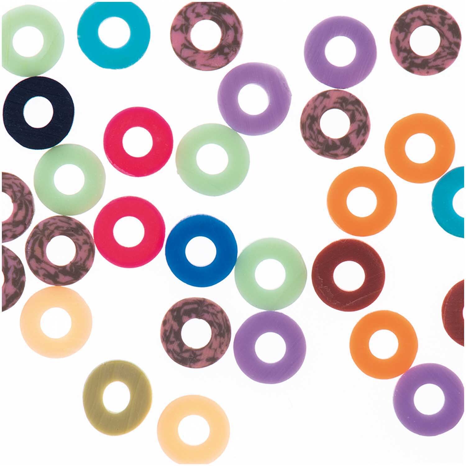 Gummischeiben Mix bunt 6x1mm 60 Stück von Rico Design, verschiedene Farben auf weißem Hintergrund.