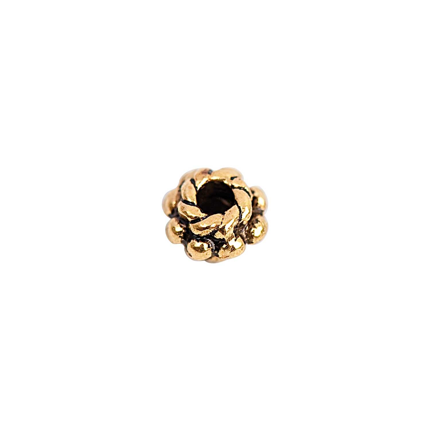 Perle flach schwarz-gold 6mm 30 Stück von Rico Design. Detailaufnahme einer goldenen Perle mit schwarzem Kern auf weißem Hintergrund.